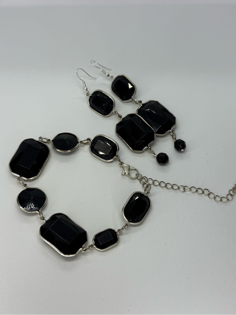 Classic-style bracelet and earring set with faceted black acrylic stones.